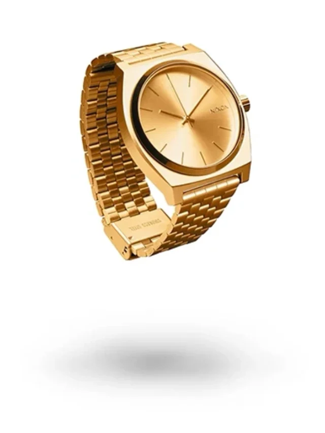 Professional product photography of a gold watch on white background with a shadow